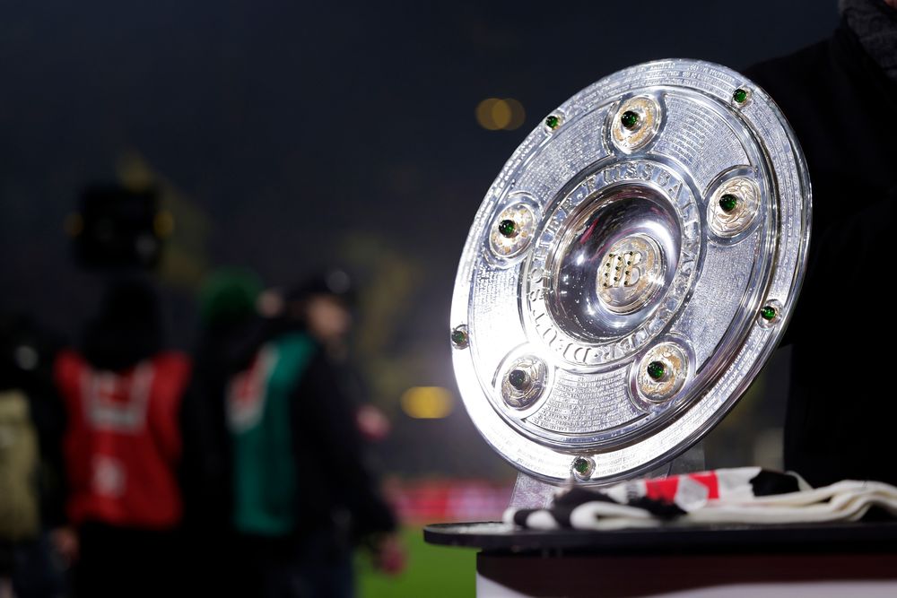 The iconic silver Bundesliga Meisterschale trophy stands on a display.